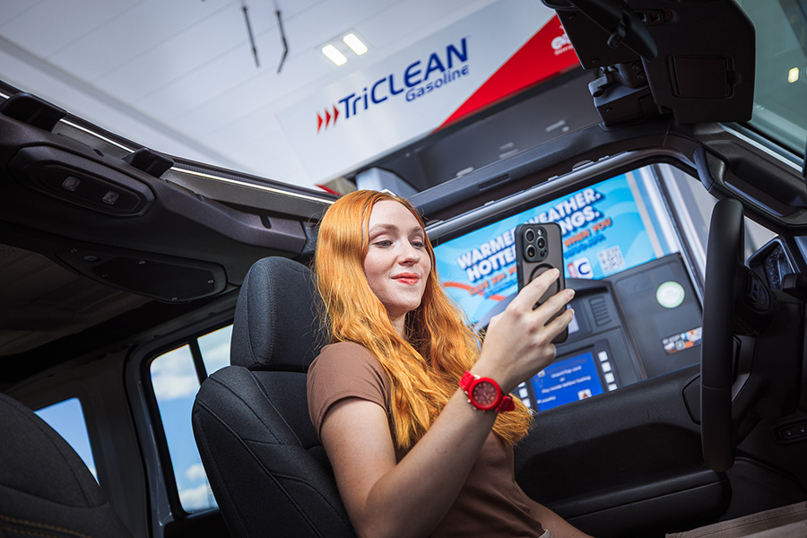 Girl getting out of car in front of CITGO station